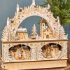 14.75" Lighted Laser Cut Wood Village Scene with Moving Figurine and Candles