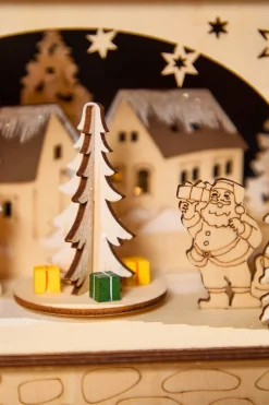 14.75" Lighted Laser Cut Wood Village Scene with Moving Figurine and Candles