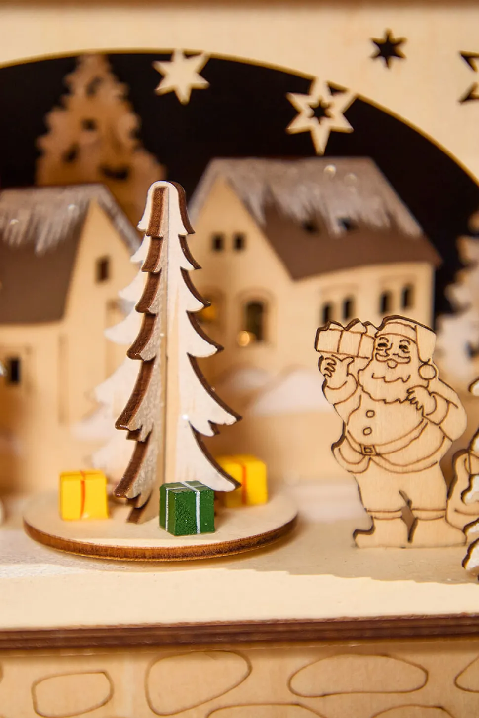 14.75" Lighted Laser Cut Wood Village Scene with Moving Figurine and Candles
