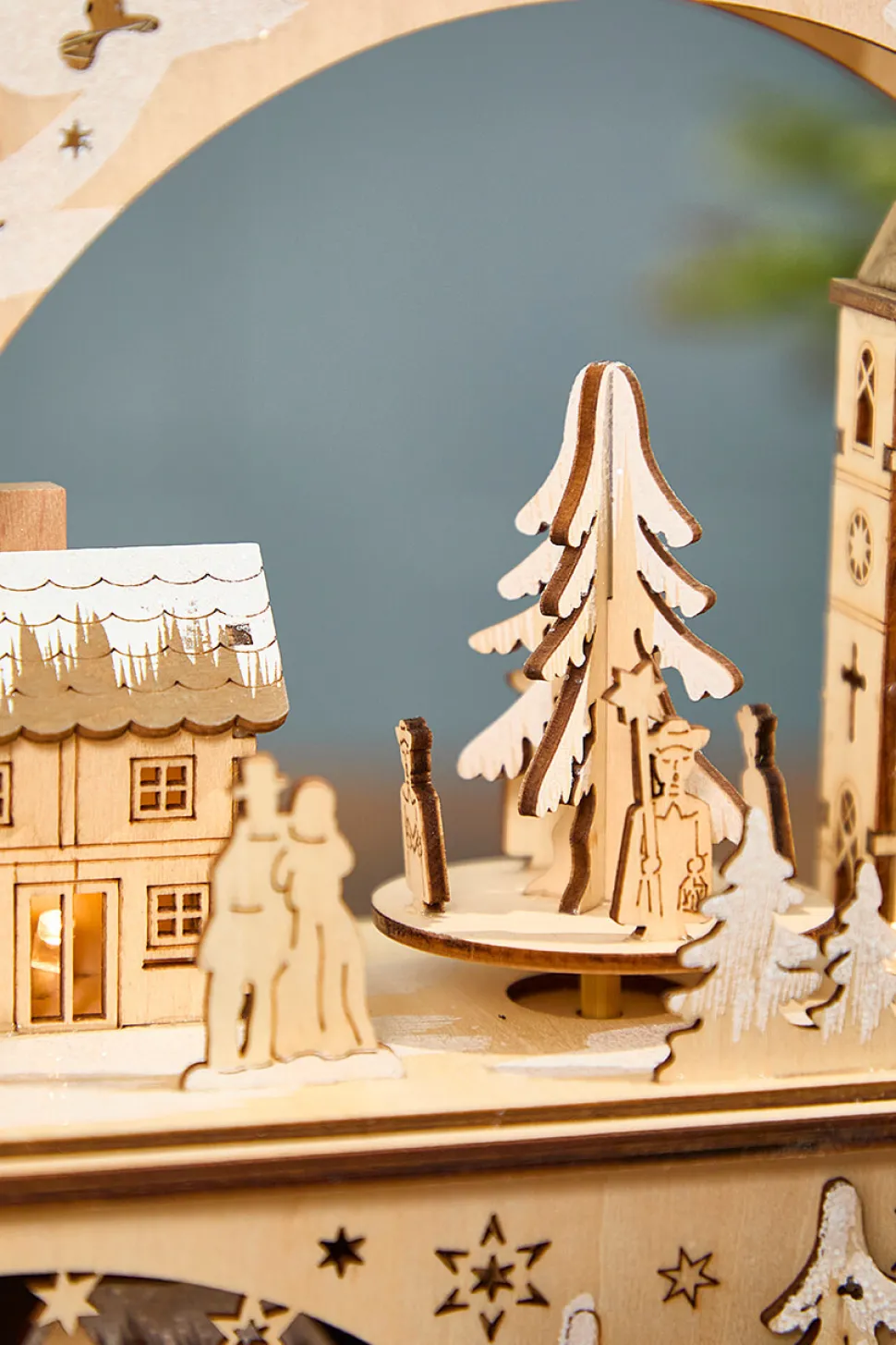 14.75" Lighted Laser Cut Wood Village Scene with Moving Figurine and Candles
