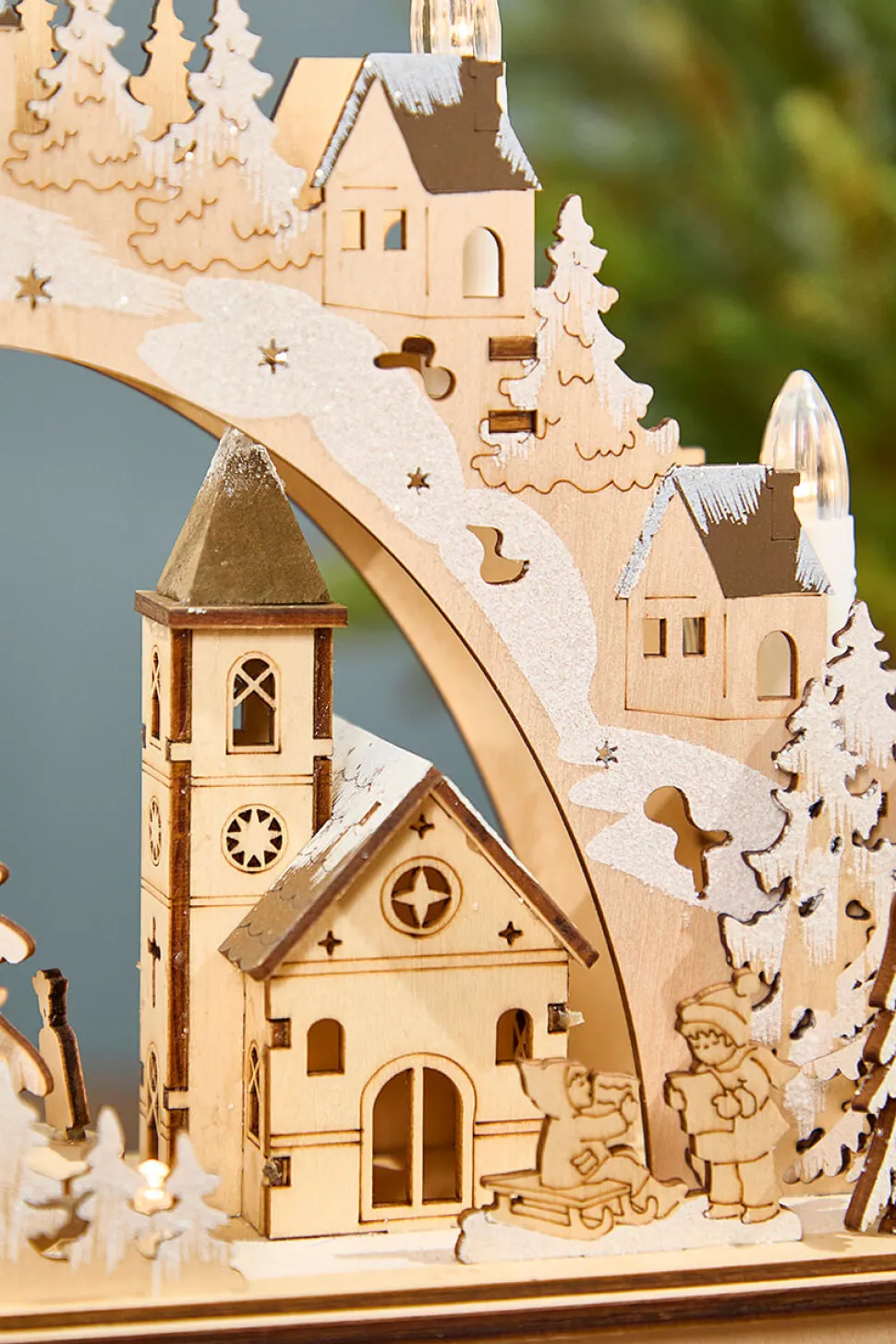 14.75" Lighted Laser Cut Wood Village Scene with Moving Figurine and Candles