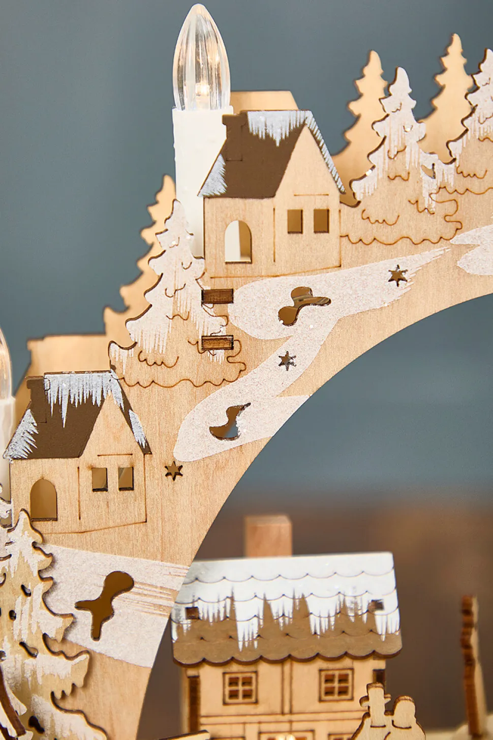 14.75" Lighted Laser Cut Wood Village Scene with Moving Figurine and Candles